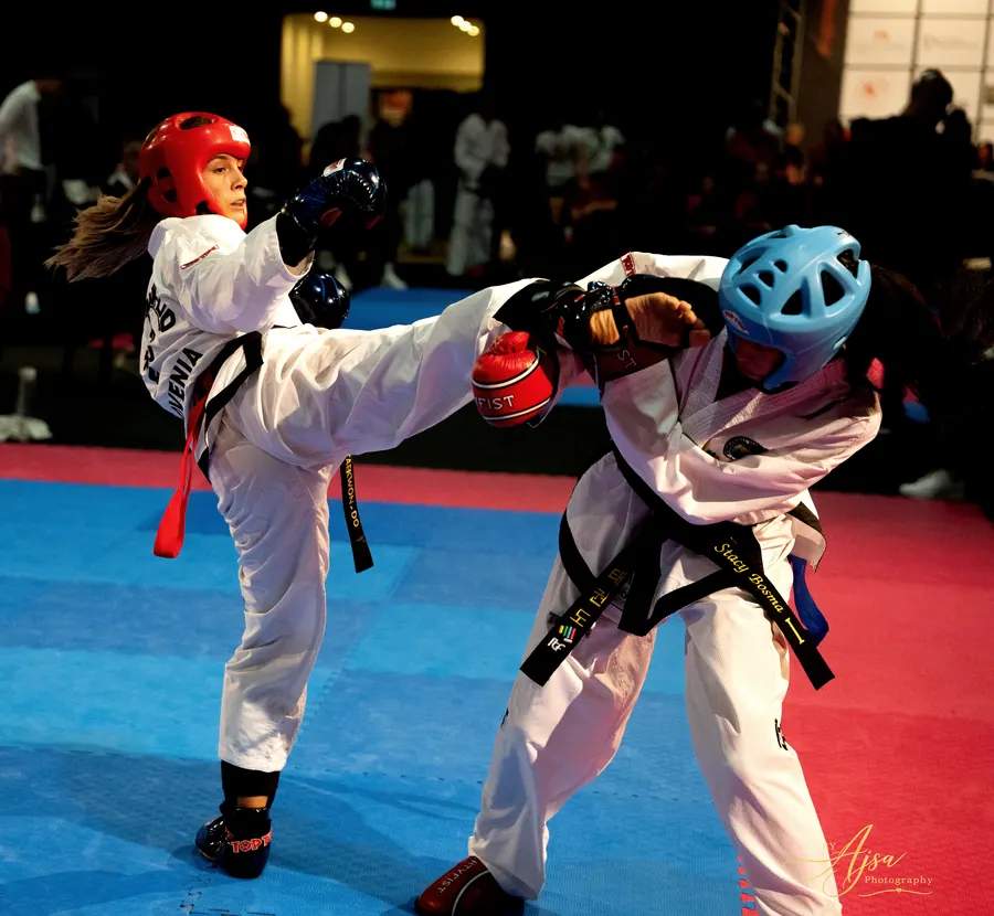 Two competitors in a close exchange in sparring