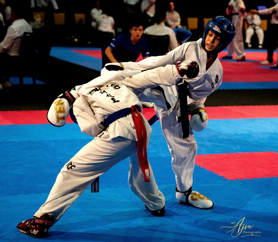Competitor leaning back from a kick during sparring