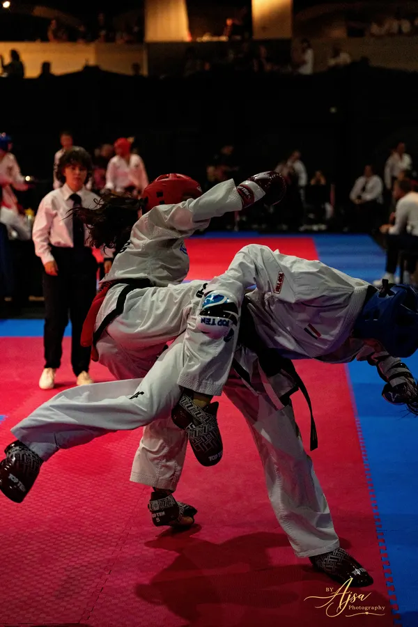A sparring exchange with one competitor airborne