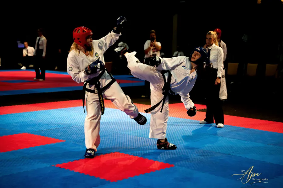 Two competitors kicking at the same moment